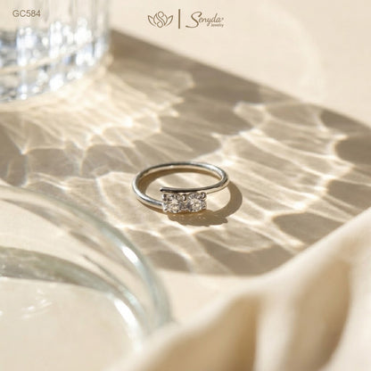 Dainty 925 sterling silver two-stone bypass ring featuring twin brilliant round cubic zirconia gems in a modern Toi et Moi setting.
