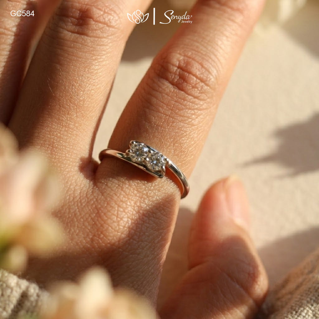 Dainty 925 sterling silver two-stone bypass ring featuring twin brilliant round cubic zirconia gems in a modern Toi et Moi setting.