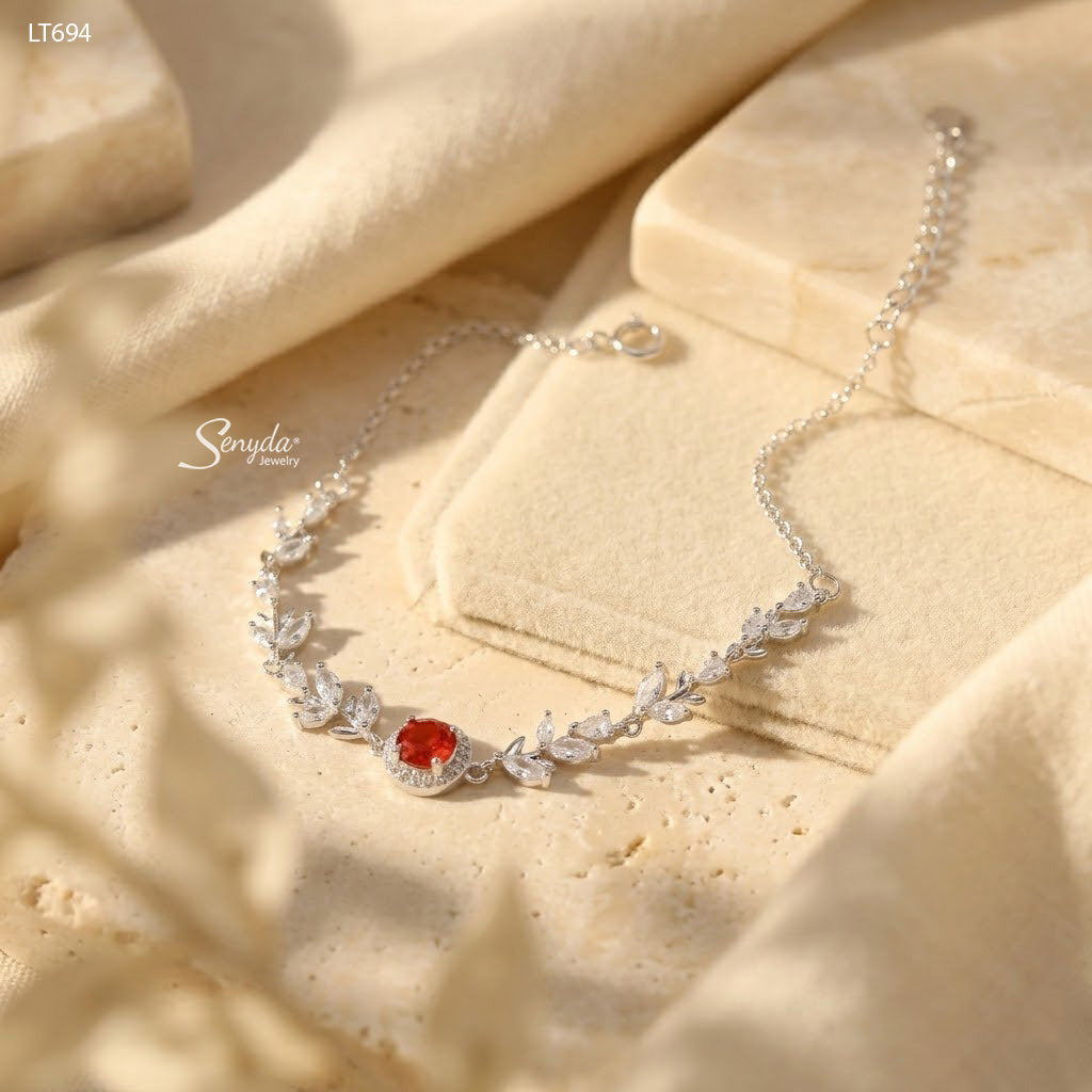 Sterling silver leaf vine bracelet with marquise cubic zirconia leaves and a 5mm halo-set colored CZ center stone