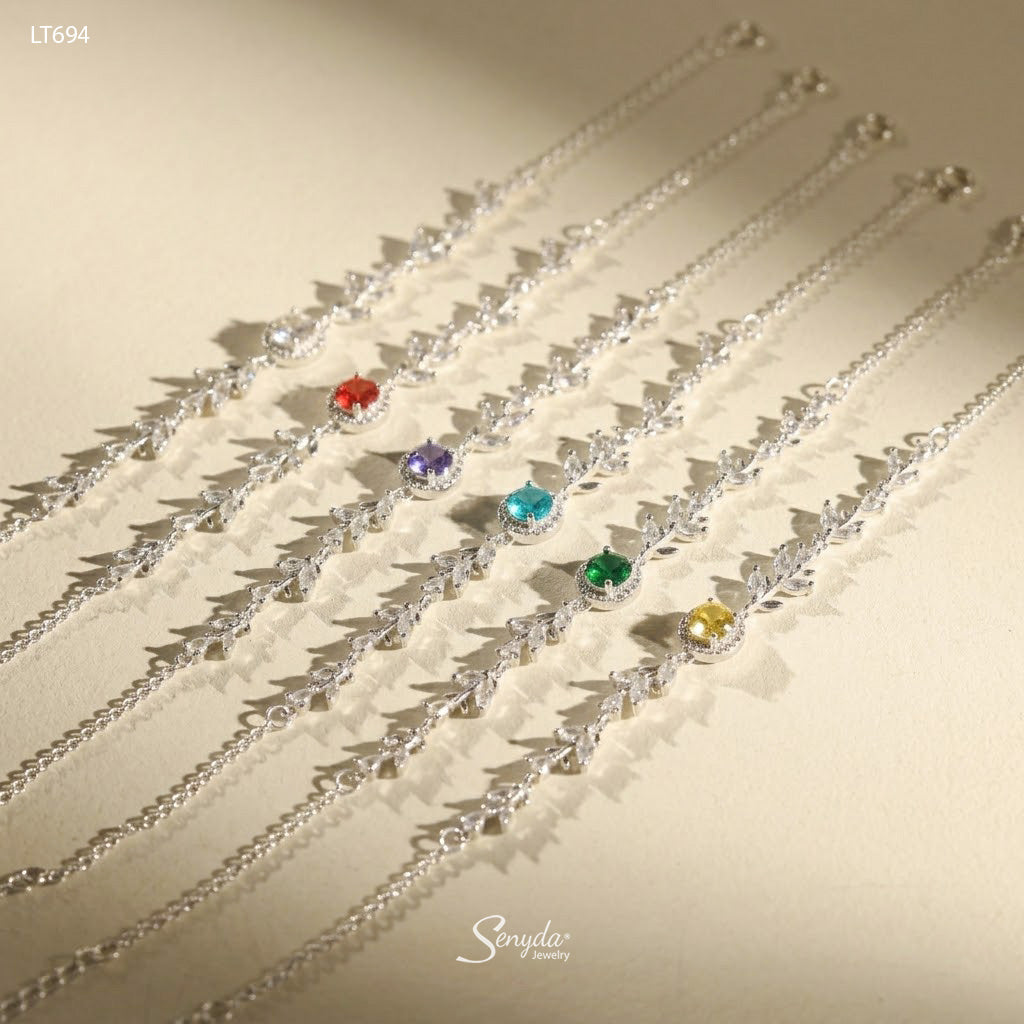 Six halo leaf vine bracelets in clear, red, purple, aqua, green and yellow birthstone colors, sterling silver and CZ