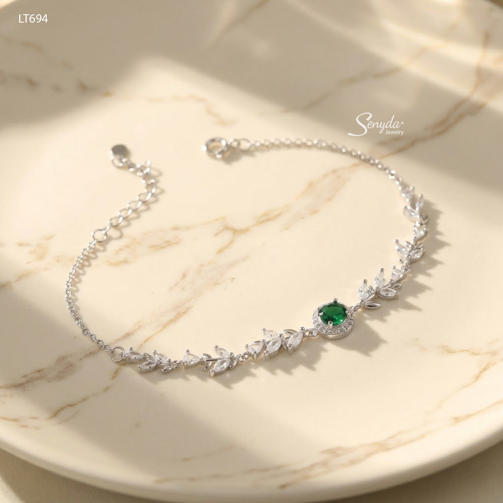 Sterling silver leaf vine bracelet with marquise cubic zirconia leaves and a 5mm halo-set colored CZ center stone