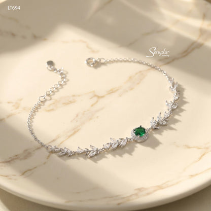 Sterling silver leaf vine bracelet with marquise cubic zirconia leaves and a 5mm halo-set colored CZ center stone