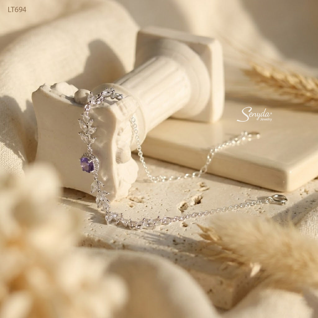 Sterling silver leaf vine bracelet with marquise cubic zirconia leaves and a 5mm halo-set colored CZ center stone