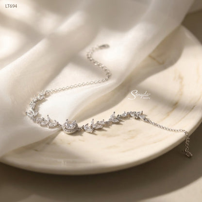 Sterling silver leaf vine bracelet with marquise cubic zirconia leaves and a 5mm halo-set colored CZ center stone