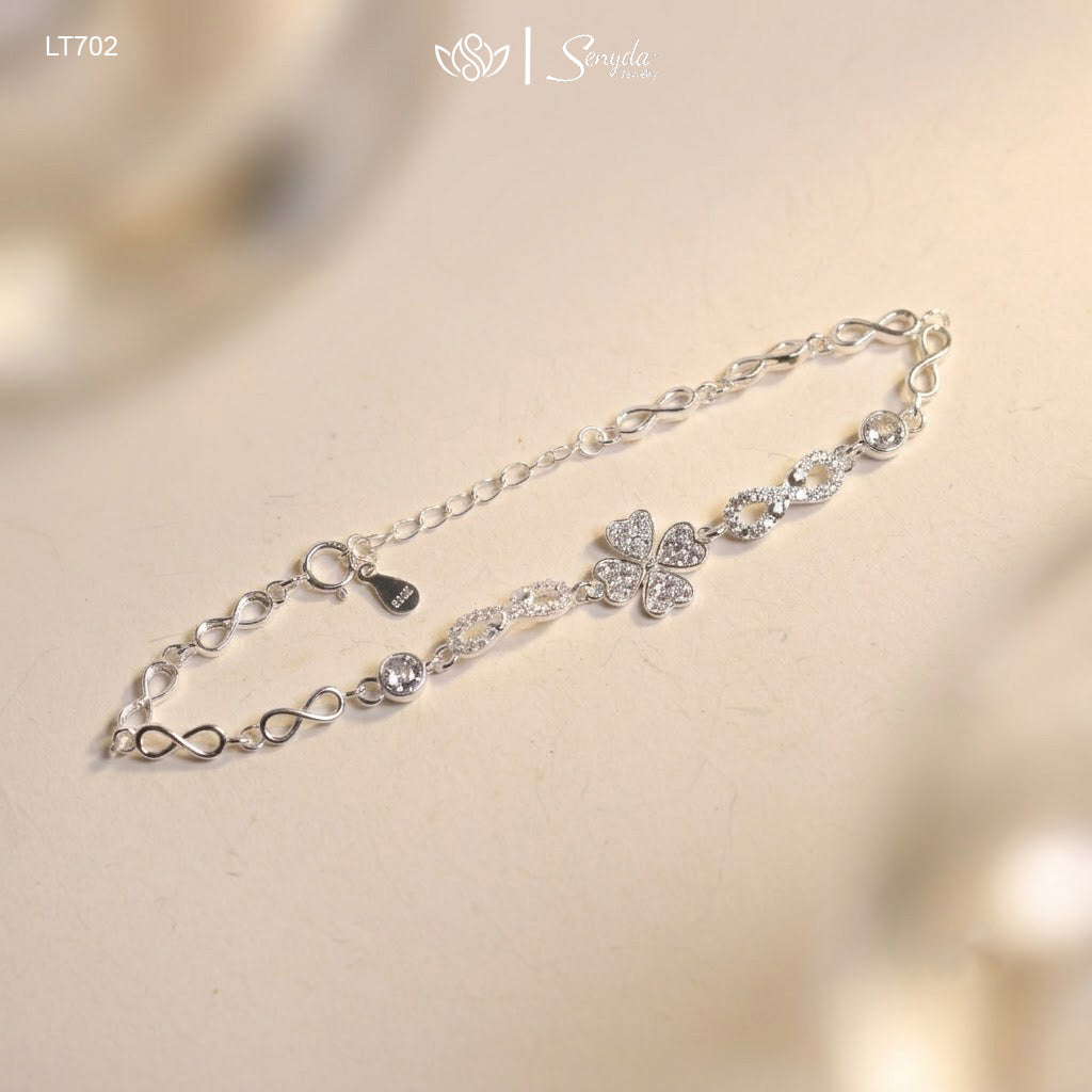 925 sterling silver clover and infinity link bracelet with bezel CZ stations, spring ring clasp and heart tag extender