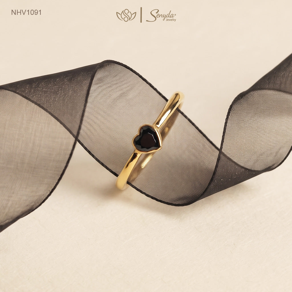Solid yellow gold ring with a faceted black heart-shaped cubic zirconia in a smooth bezel setting