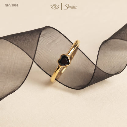 Solid yellow gold ring with a faceted black heart-shaped cubic zirconia in a smooth bezel setting