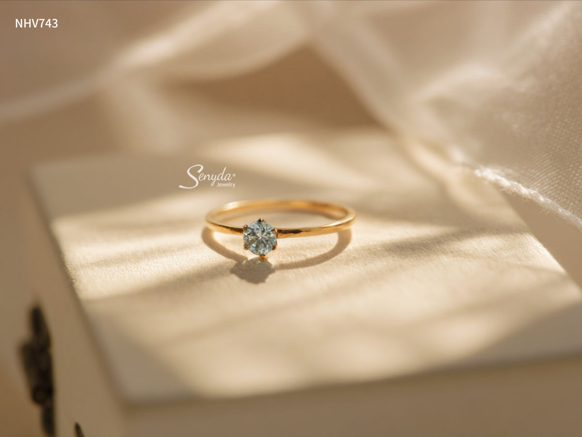 Dainty solid gold solitaire ring with a 3.5mm round stone in a six-prong setting on a thin 1mm band