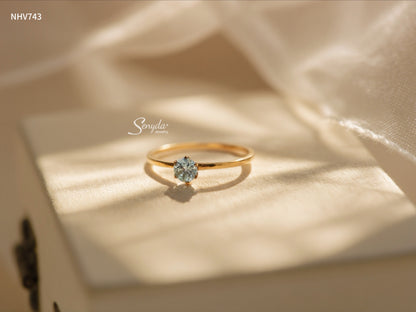 Dainty solid gold solitaire ring with a 3.5mm round stone in a six-prong setting on a thin 1mm band