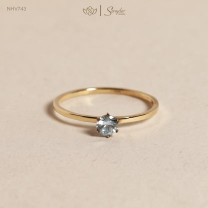 Dainty solid gold solitaire ring with a 3.5mm round stone in a six-prong setting on a thin 1mm band