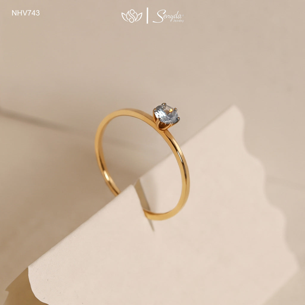 Dainty solid gold solitaire ring with a 3.5mm round stone in a six-prong setting on a thin 1mm band