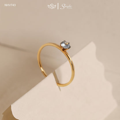 Dainty solid gold solitaire ring with a 3.5mm round stone in a six-prong setting on a thin 1mm band