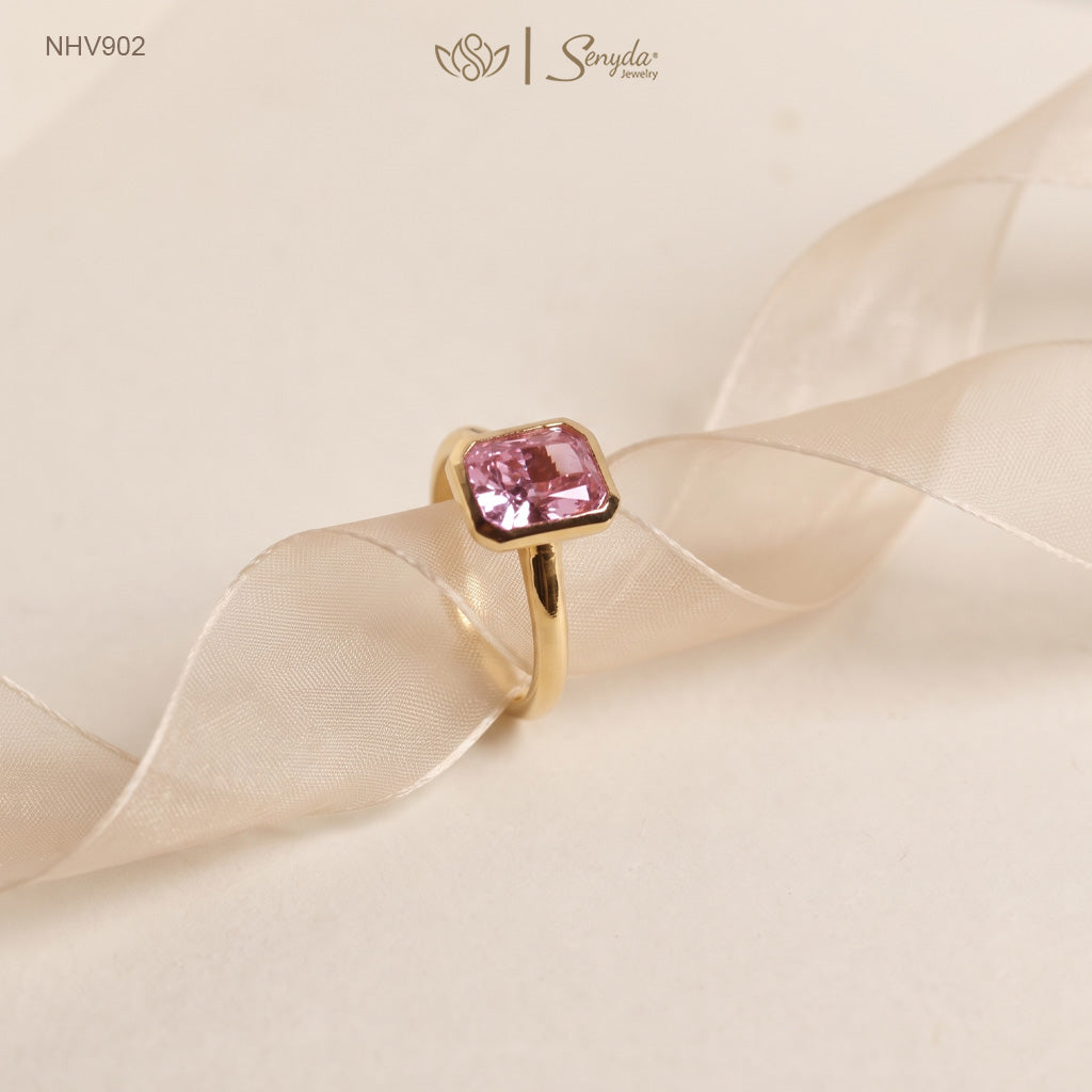 Solid yellow gold solitaire ring with a 6x8mm pink radiant-cut cubic zirconia in a smooth bezel setting
