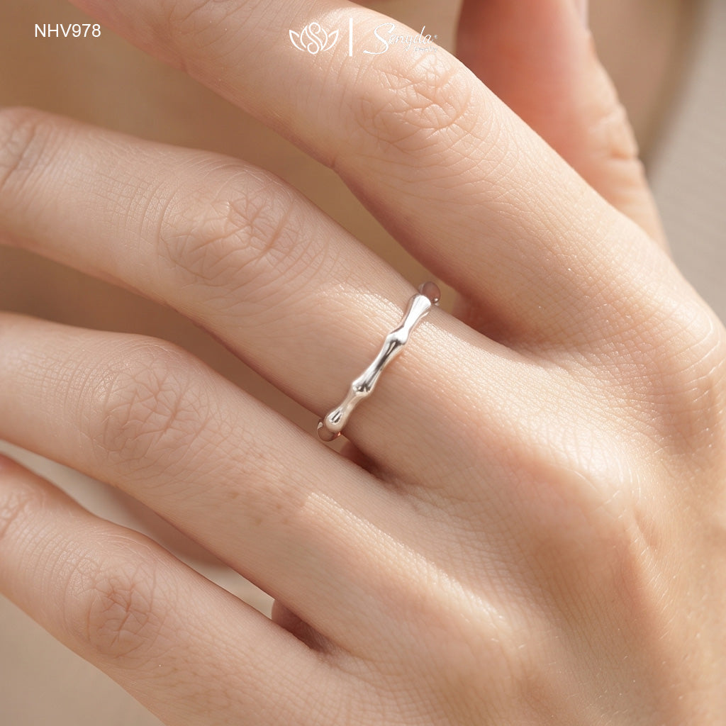 Dainty 10K solid gold bamboo joint stacking ring with an organic textured node design.