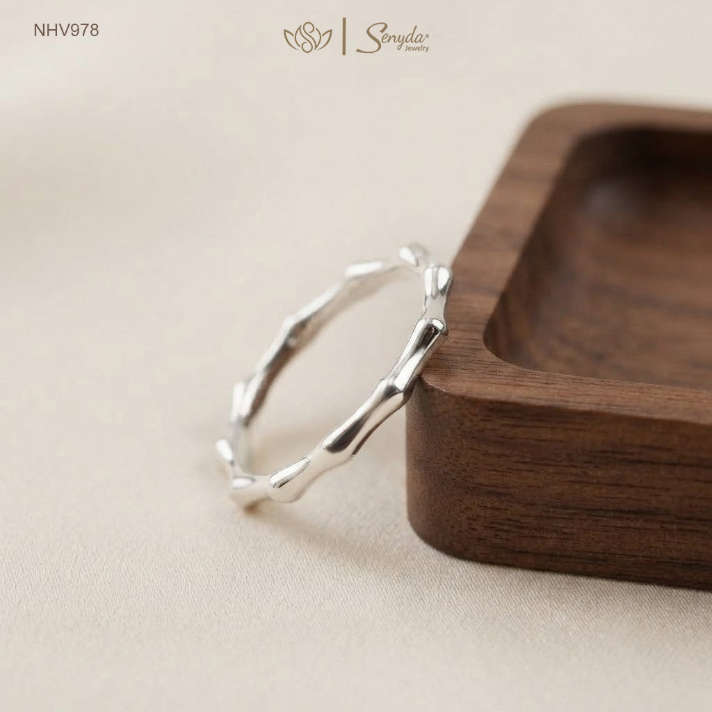 Dainty 10K solid gold bamboo joint stacking ring with an organic textured node design.