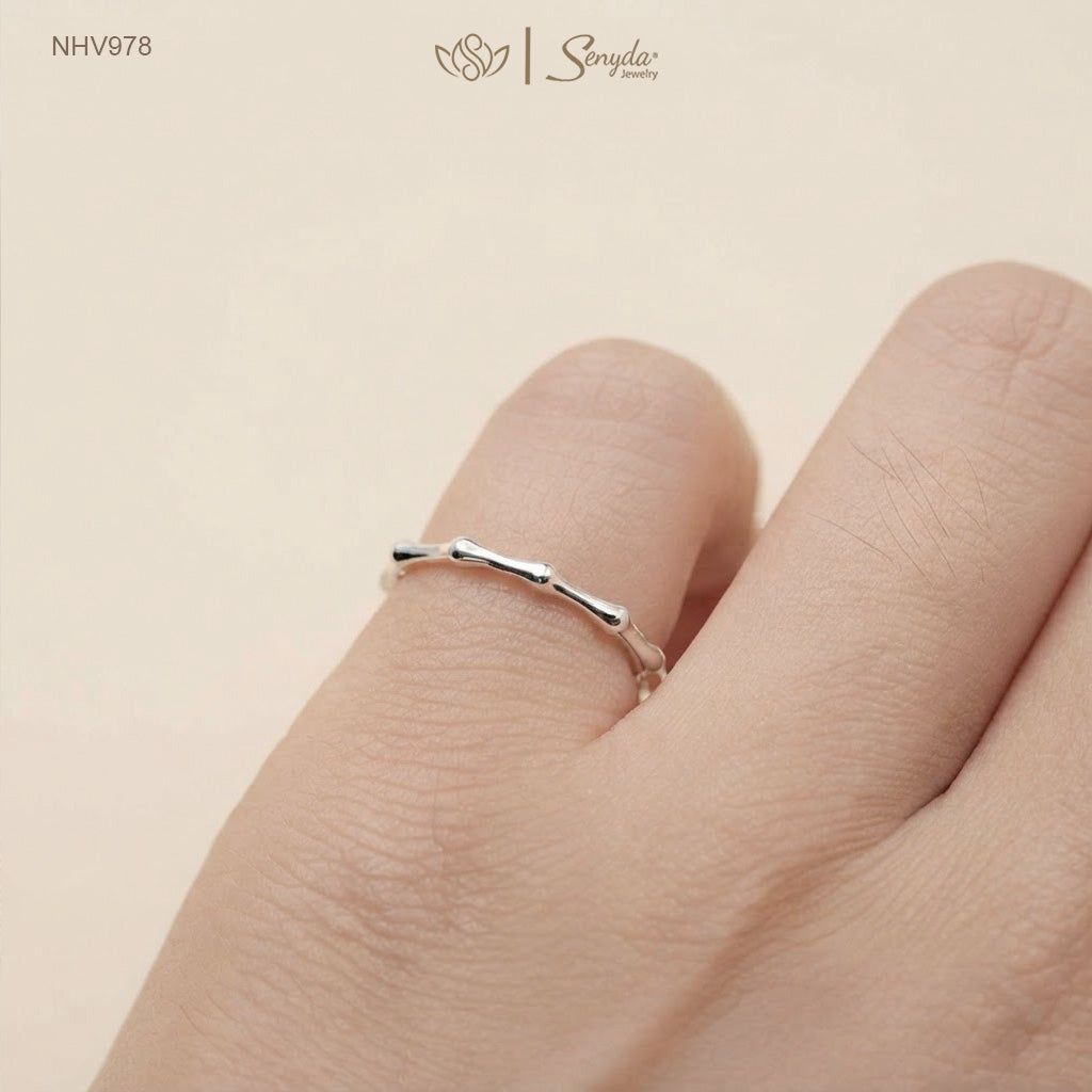 Dainty 10K solid gold bamboo joint stacking ring with an organic textured node design.