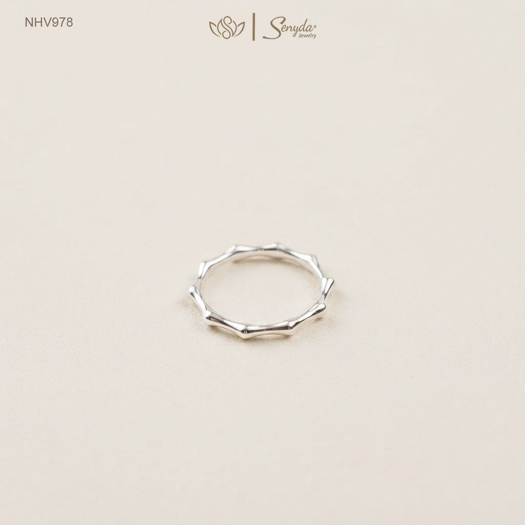 Dainty 10K solid gold bamboo joint stacking ring with an organic textured node design.