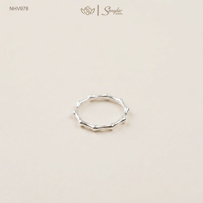 Dainty 10K solid gold bamboo joint stacking ring with an organic textured node design.
