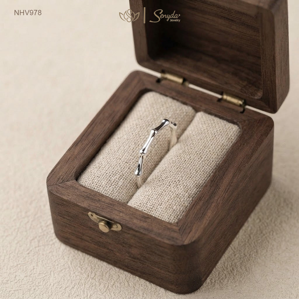 Dainty 10K solid gold bamboo joint stacking ring with an organic textured node design.